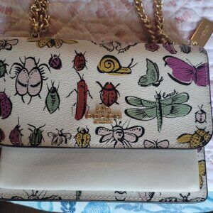 Like New Coach Mini Klare crossbody with Creature print...Retail $328